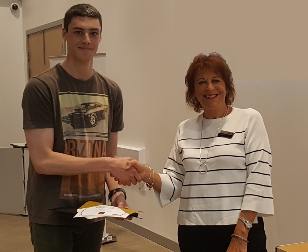 Mike Baker Year 13 Scholar of the Year, George Binfield of Longbenton High School, receives his award from Anne Reece, chair of the Reece Foundation